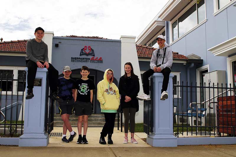 HIGH SPIRITS AFTER A CHALLENGING YEAR... Students Alistair Gibson, Noah Moore, Brayden Wilson, Jasmine Ricardo, Sharni Wilson and Nedd Gladman pictured out the front of their state-of-the-art school building. Photo: Kelly Lucas