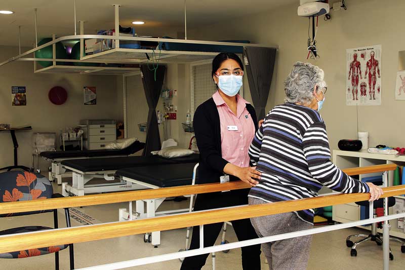 CARING FOR THE COMMUNITY... Shepparton Private Hospital physiotherapist, Shashwati Das with a rehabilitation client. Photo: Kelly Lucas.
