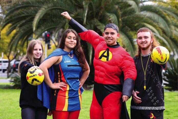 POWER UP... The Academy of Sport, Health & Education is working to improve equality and life outcomes, providing accessible, culturally-relevant education and training to primarily – but not exclusively – Aboriginal people. Pictured from left are students Ch'e Atkinson, Vanessa Harbrow dressed as Rumba Woman, Matthew Atkinson as ASHE Man, and Noah Cranage in the lead up to ASHEfest 2022. Photo: Kelly Carmody