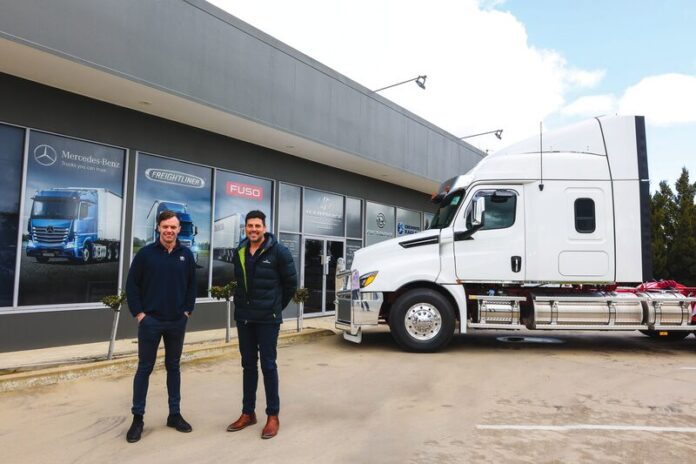 100 YEARS... Hartwigs Trucks salesman Russell Eden and branch manager Simon Calogero at their refreshed Midland Highway building. Photo: Kelly Carmody